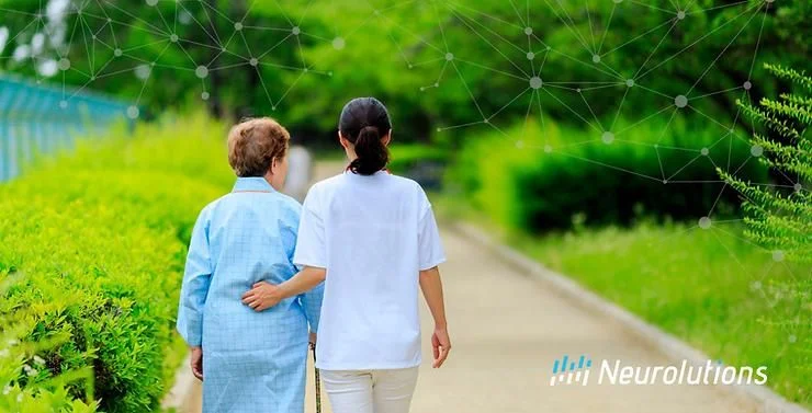 nurse walking with elderly patient