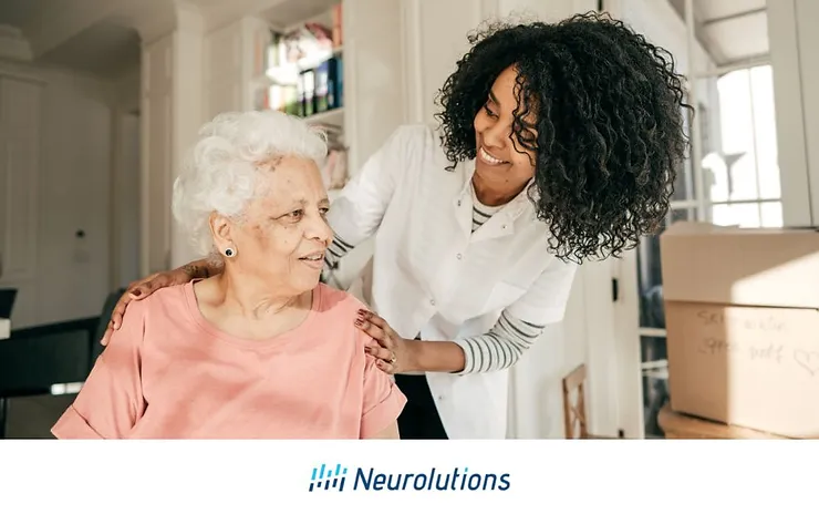 nurse helping elder patient in her home