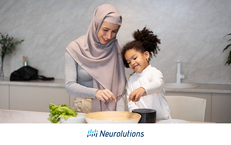 mom and daughter making a meal in the kitchen