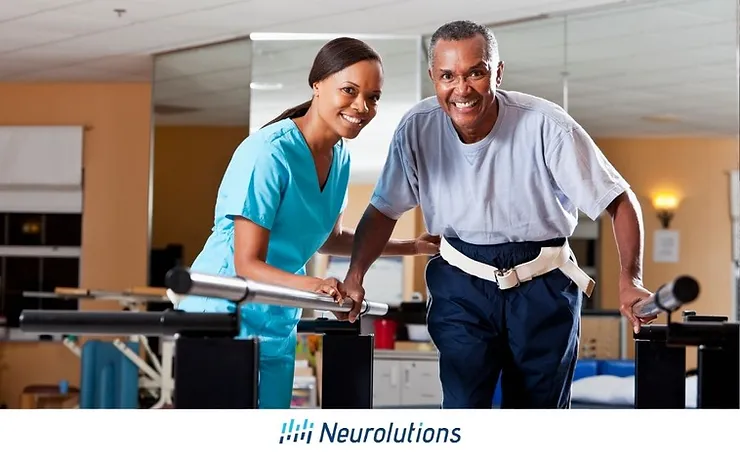 nurse helping patient walk through therapy